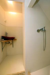 a bathroom with a shower and a sink at A74 - Rua do Canal 1 Bed Flat in Lagos