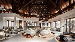 een grote woonkamer met banken en stoelen bij Maradiva Villas Resort and Spa in Flic-en-Flac