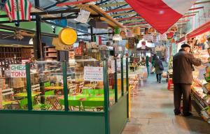 a man is standing in a grocery store with a store at Résidence de la Marquise in Nancy