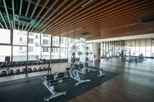 a gym with treadmills and weights in a building at C&Y Lee CIean@Cozy House in Melaka