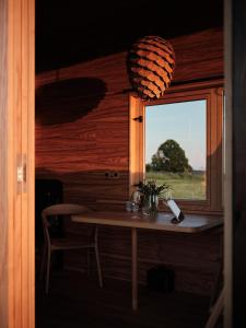 a small table in a room with a window at Glamping Na Malém Háji in Hora Svaté Kateřiny