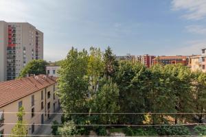 a view of a city with buildings and trees at I Host Apartment - Asiago 4 in Milan