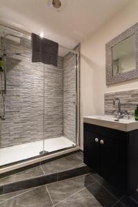 a bathroom with a shower and a sink at The Clockhouse Bewdley in Bewdley