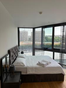 En eller flere senger på et rom på Prime İstanbul Residances Deluxe 2 Bedroom Flat