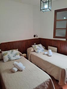 Cama o camas de una habitación en HolidaynorthTenerife Caserío Rural Los Charcos