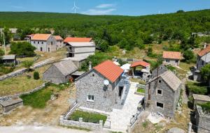 an aerial view of an old house with a windmill at Villa Lucia in Vukići