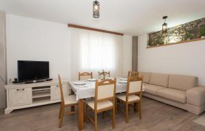 a living room with a table and a couch at Villa Lucia in Vukići