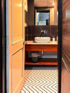 a bathroom with a sink and a mirror at Hoztel Jaipur in Jaipur