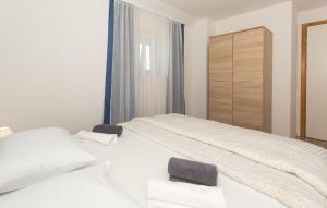 a bedroom with two beds and a dresser at Villa Lucia in Vukići +18 photos