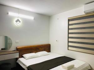 Giường trong phòng chung tại Villa Gỗ - Mộc Châu