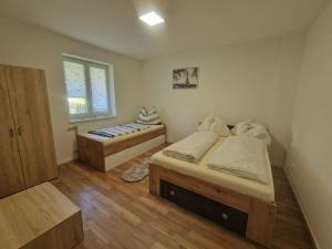 Postel nebo postele na pokoji v ubytování Apartment Emma