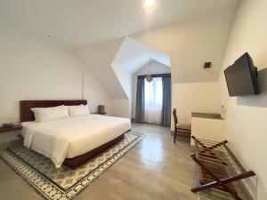 TV a/nebo společenská místnost v ubytování DACO Hotel