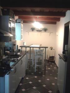 a kitchen with a counter and a table in it at Chaluba Bully 243 in Donovaly +12 photos