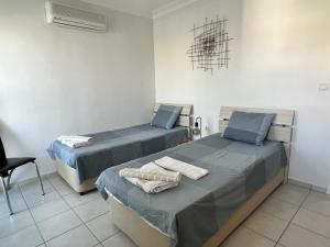 a hospital room with two beds and a chair at Lovely 2-Bed Apartment in Side - Ilica in Side