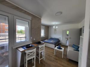 A bed or beds in a room at Apartman LALA