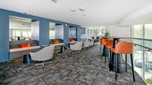 a bar with chairs and tables in a building at 1BR Mission Bay w Gym nr Caltrain SFO-25 in San Francisco