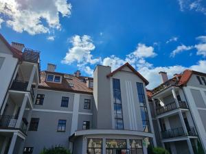 a group of buildings with a blue sky in the background at apartament 34 in Szczecinek