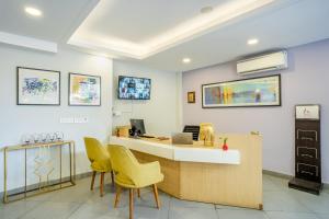an office with a desk and chairs in a room at Inde Hotel Sec- 49, Golf Course Extension, Gurgaon in Gurgaon
