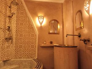 a bathroom with a shower and a toilet at Dar Taliwint in Marrakech