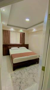 Een bed of bedden in een kamer bij Luwi