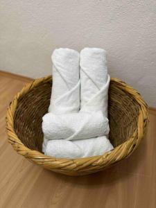 a basket filled with white towels on a floor at Ayten Hanım Konağı in Ürgüp