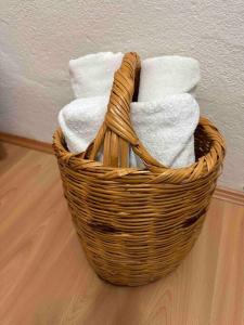 a basket filled with towels on a wooden floor at Ayten Hanım Konağı in Ürgüp