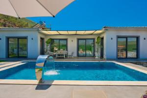 a swimming pool in the backyard of a villa at Villa Sincap in Fethiye