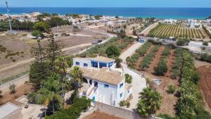 an aerial view of a house with the ocean in the background at Villa Le Charme Marin - Noto, Marzamemi, San Lorenzo in San Lorenzo