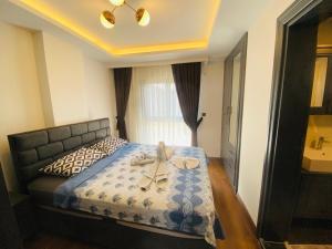 Postel nebo postele na pokoji v ubytování Villa Bozay Evinizdeki rahatlık huzurlusakin tatil