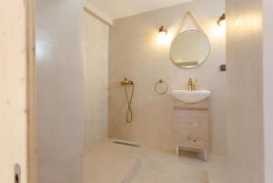 a bathroom with a sink and a mirror at Evaxenia's House Old Town Rhodes in Rhodes Town