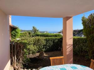 a view of a patio with a table and chairs at Sardegna Beach Cala Reale in Santa Marinella
