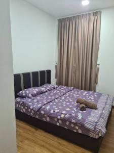Кровать или кровати в номере Nino Homestay
