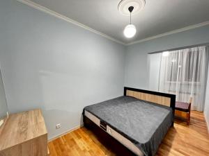 Säng eller sängar i ett rum på Modern Apartment in Yerevan