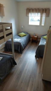 Postel nebo postele na pokoji v ubytování Hostel Tikka