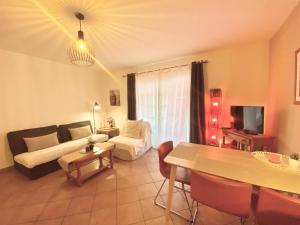 a living room with a couch and a table at Casa Cecilia in Playa de San Juan