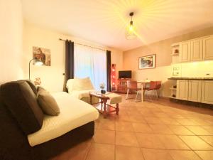 a living room with a couch and a table at Casa Cecilia in Playa de San Juan
