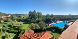 an aerial view of a house with a swimming pool at Sardegna Beach Ginepro in Olbia +20 photos