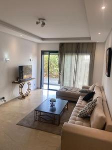 Un lugar para sentarse en Prestigia 3 Bedrooms with swimming pool