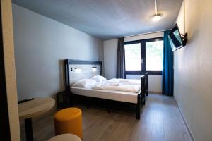 Postel nebo postele na pokoji v ubytování a&o Rotterdam City