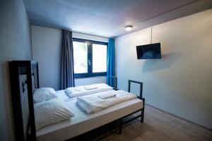 Postel nebo postele na pokoji v ubytování a&o Rotterdam City