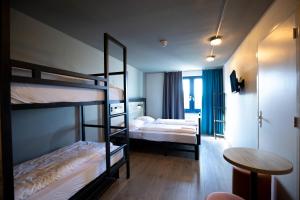 Postel nebo postele na pokoji v ubytování a&o Rotterdam City