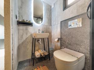 a bathroom with a toilet and a sink at Mossa Afkule Kayaköy in Fethiye +19 photos