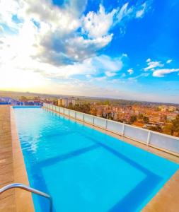 a large swimming pool on the roof of a building at Jay Cosy Homes in Kiambaa