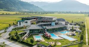 an aerial view of a building with a swimming pool at TOP 8 Apartment - Zell am See - Kaprun in Piesendorf