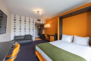 Postel nebo postele na pokoji v ubytování Amrâth Airport Hotel Rotterdam