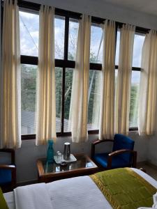 Ένα ή περισσότερα κρεβάτια σε δωμάτιο στο Hotel Caveri Inn