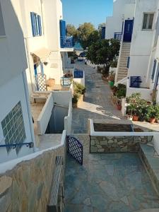 a street in a town with white buildings at Tinos Boutique House in Tinos