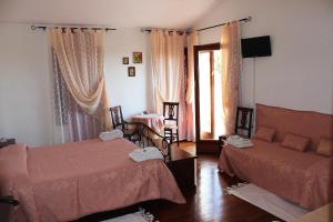 Postel nebo postele na pokoji v ubytování Guest house Villa di Judighes