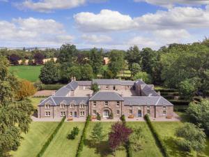 an aerial view of a large house in a field at Meikleour Arms Hotel & Restaurant in Meikleour