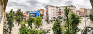 a view of a city with buildings and trees at D&D Apartment in Prishtina in Pristina